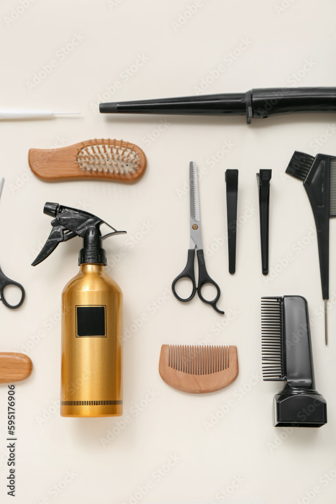 Composition with hairdressing accessories on light background