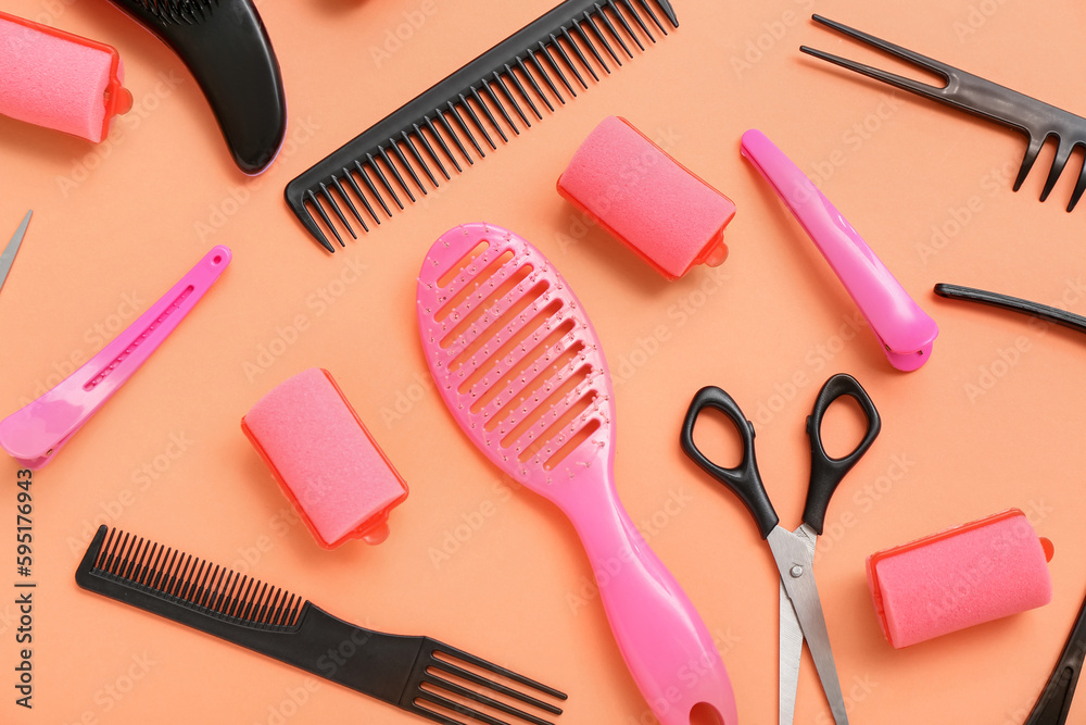 Composition with hairdressing accessories on red background