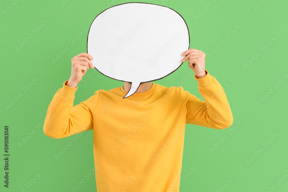 Handsome man with blank speech bubble on green background