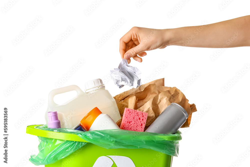 Woman throwing crumpled paper into trash bin isolated on white background