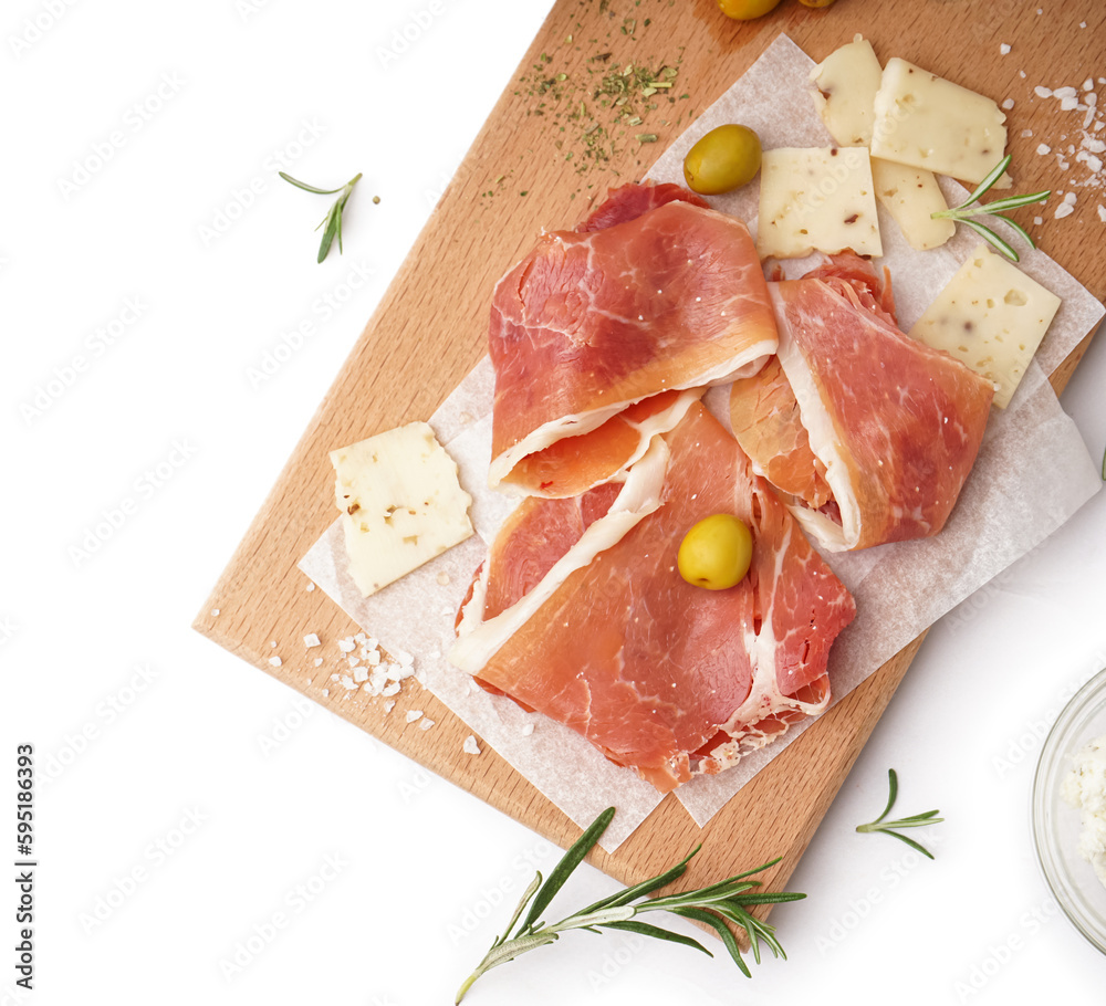 Wooden board with tasty jamon slices on light background