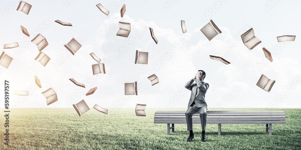 Young man in summer park on bench do not want to see anything