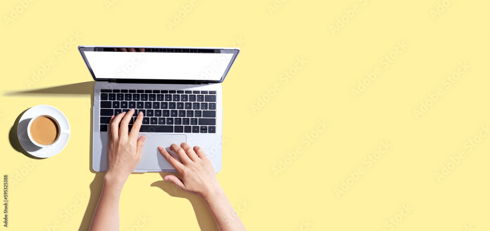 Person using a laptop computer from above