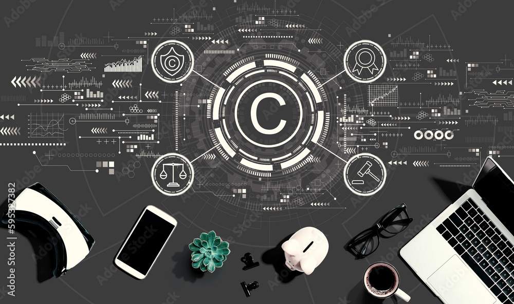 Copyright concept with electronic gadgets and office supplies - flat lay