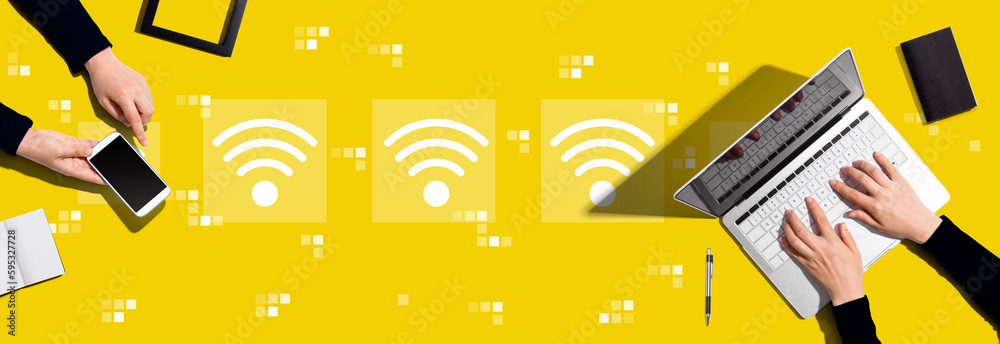 Wifi concept with two people working together