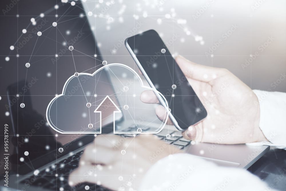 Close up of businessman hands using laptop and cellphone with glowing cloud inside sphere connection