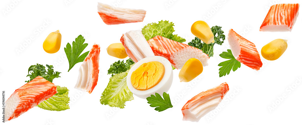 Falling crab sticks salad ingredients isolated on white background