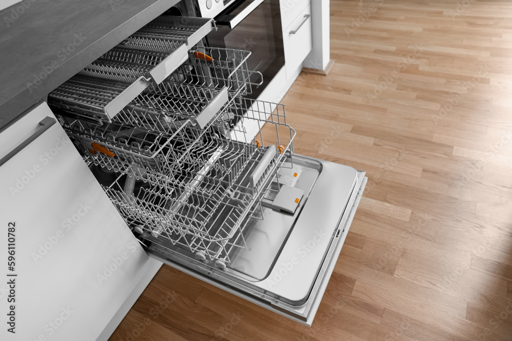 Open dishwasher in modern kitchen