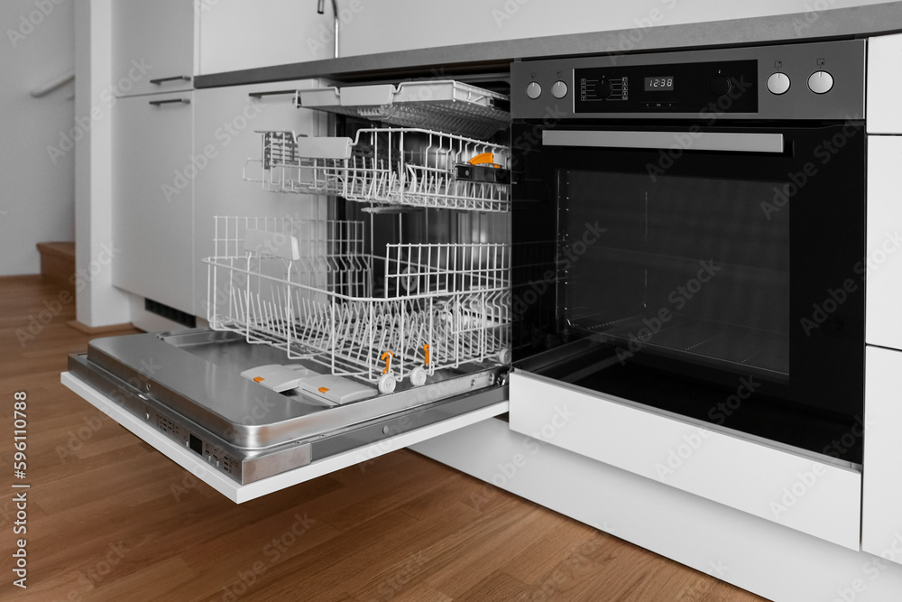 Open dishwasher in modern kitchen