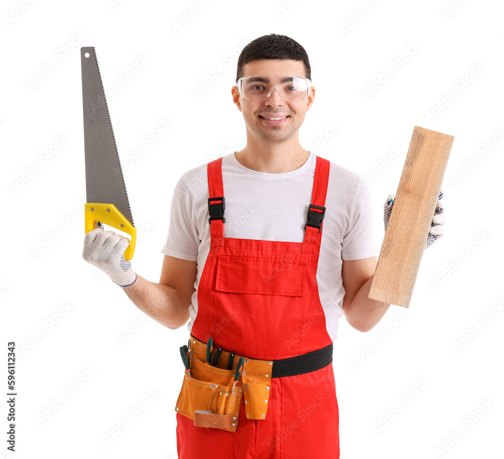 Young carpenter with wooden plank and handsaw on white background