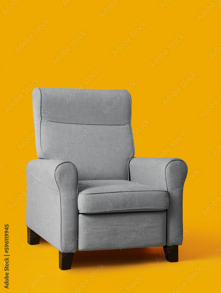 Cozy grey armchair on orange background