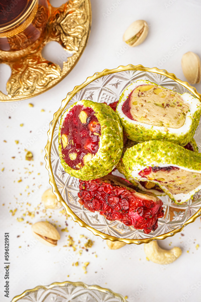 Bowl with tasty Turkish delight on light background, closeup