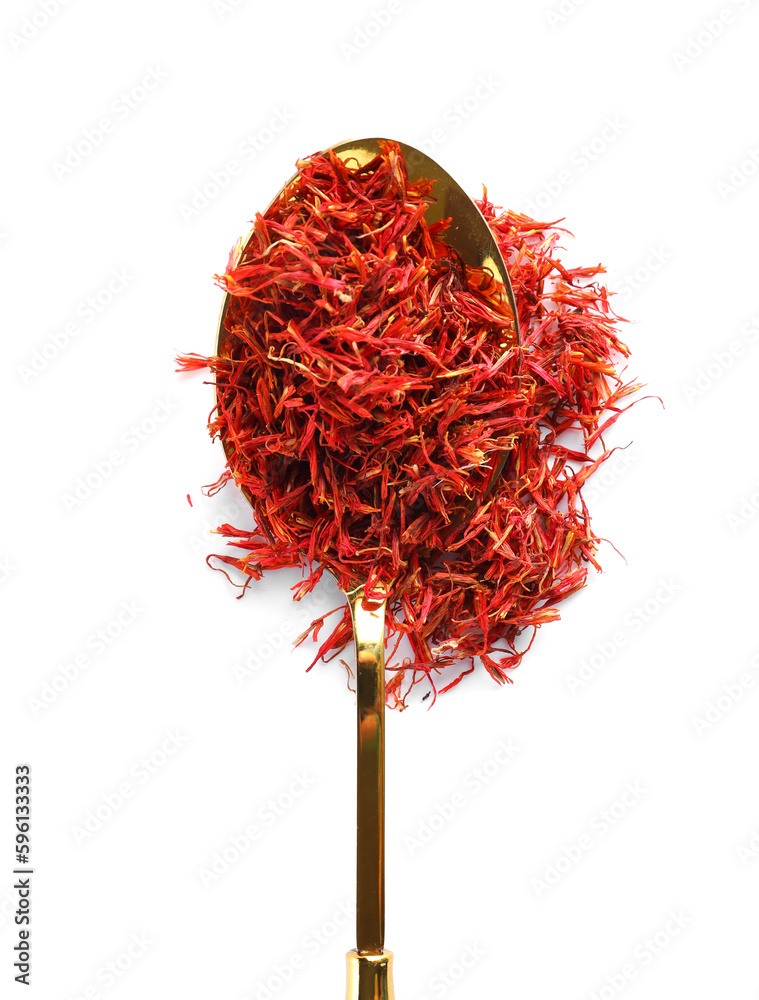 Spoon with pile of saffron on white background