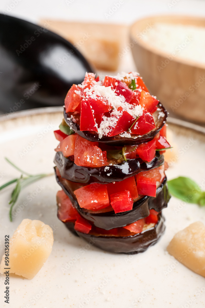 Plate with tasty baked Eggplant Parmesan on table, closeup