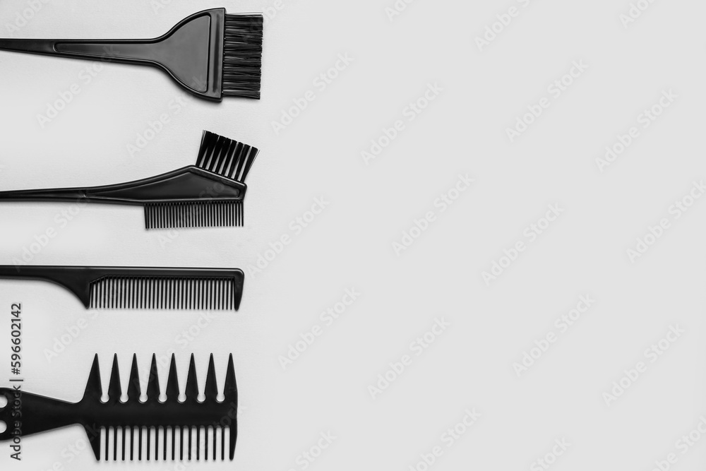 Hairdressers brushes on grey background