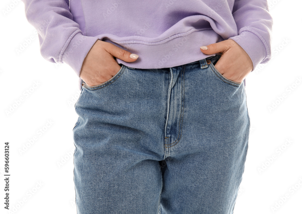 Young woman in stylish jeans on white background, closeup