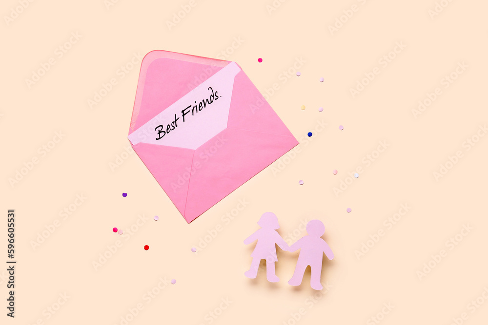 Human figures holding hands and envelope with gift card for Friendship Day on beige background