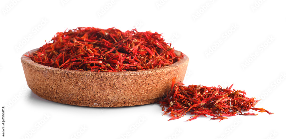 Wooden bowl with pile of saffron on white background