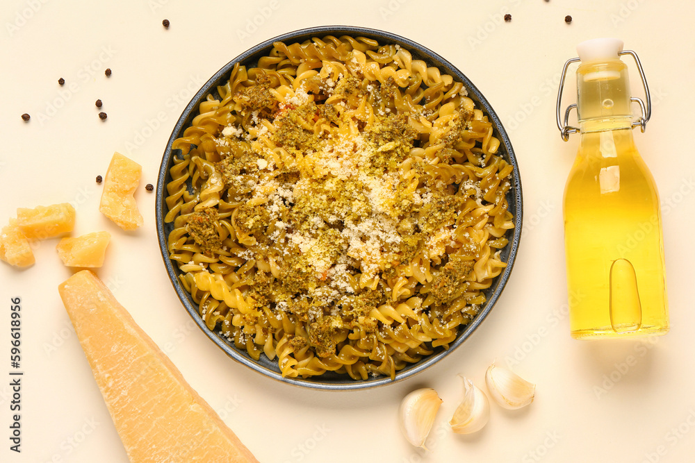 Plate of tasty Italian pasta with Parmesan cheese on white background