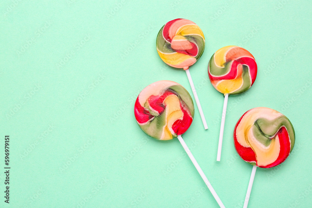 Colorful lollipops on turquoise background