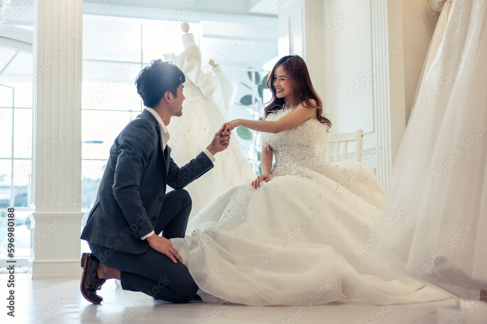 Asian young man making a surprise proposal of marriage to girlfriend. 