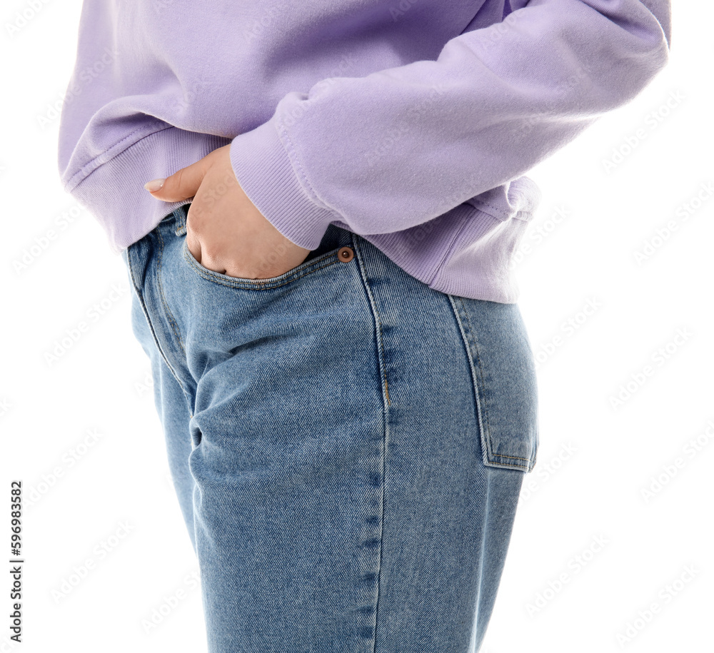 Young woman in stylish jeans on white background, closeup