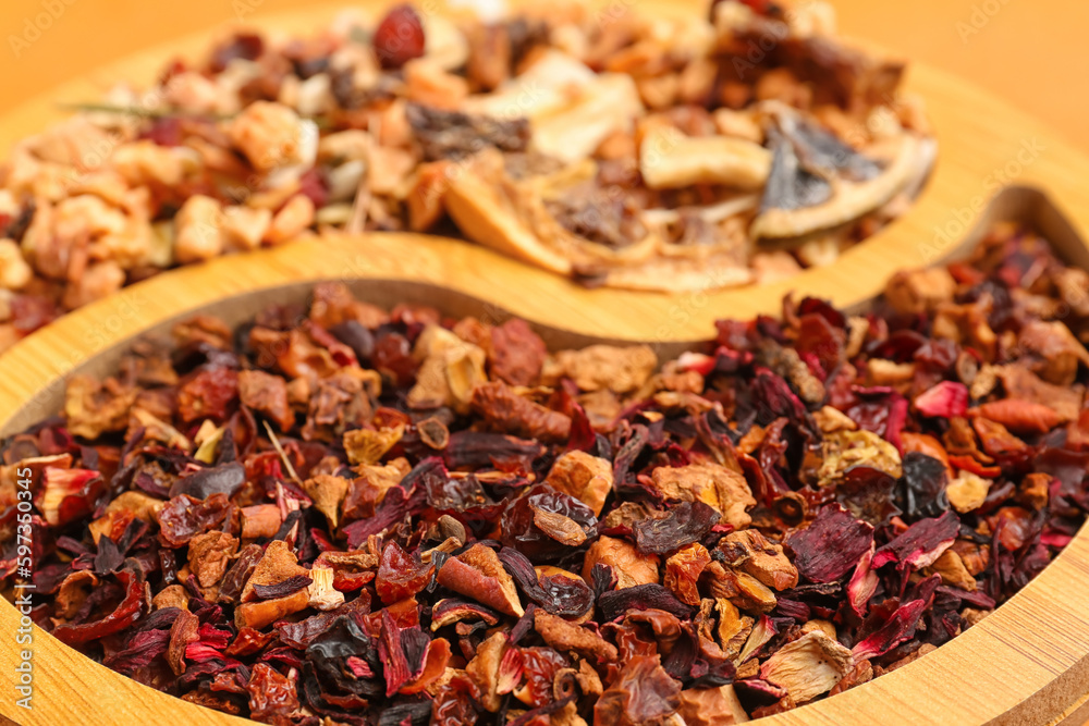 Plate with dried fruit tea as background, closeup