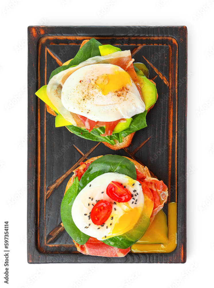 Wooden board with tasty eggs Benedict isolated on white background