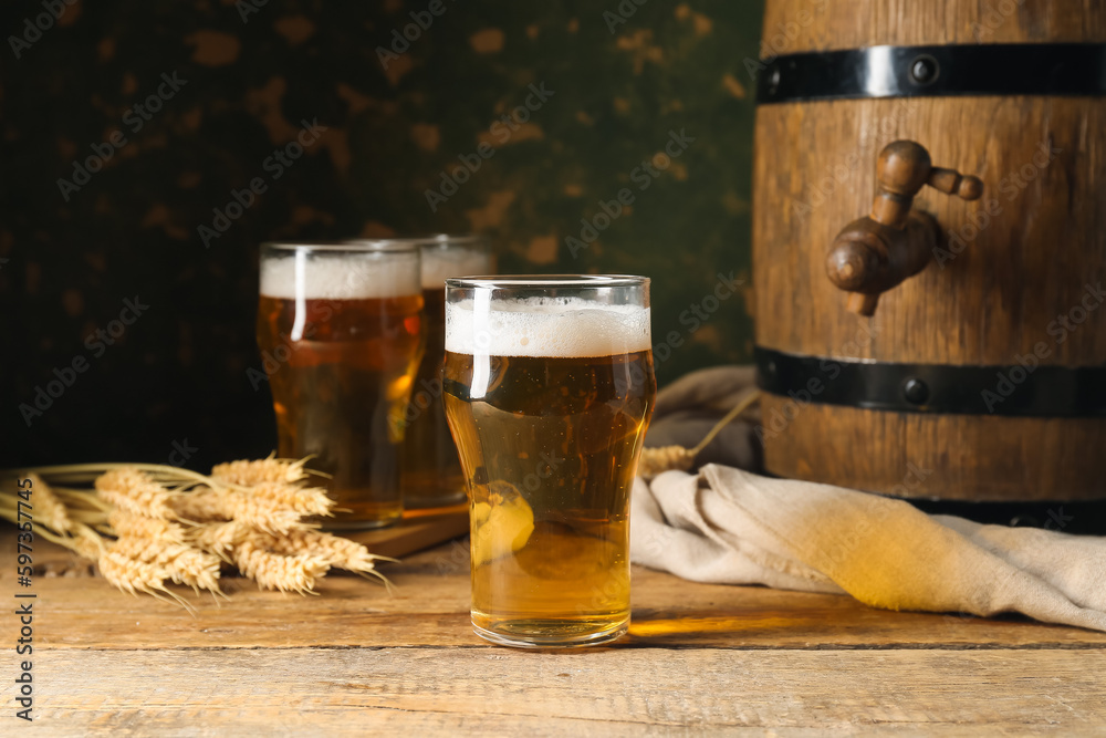 Glass of cold beer on table