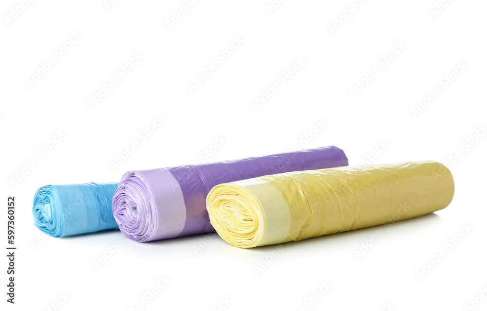 Colorful rolls of garbage bags isolated on white background