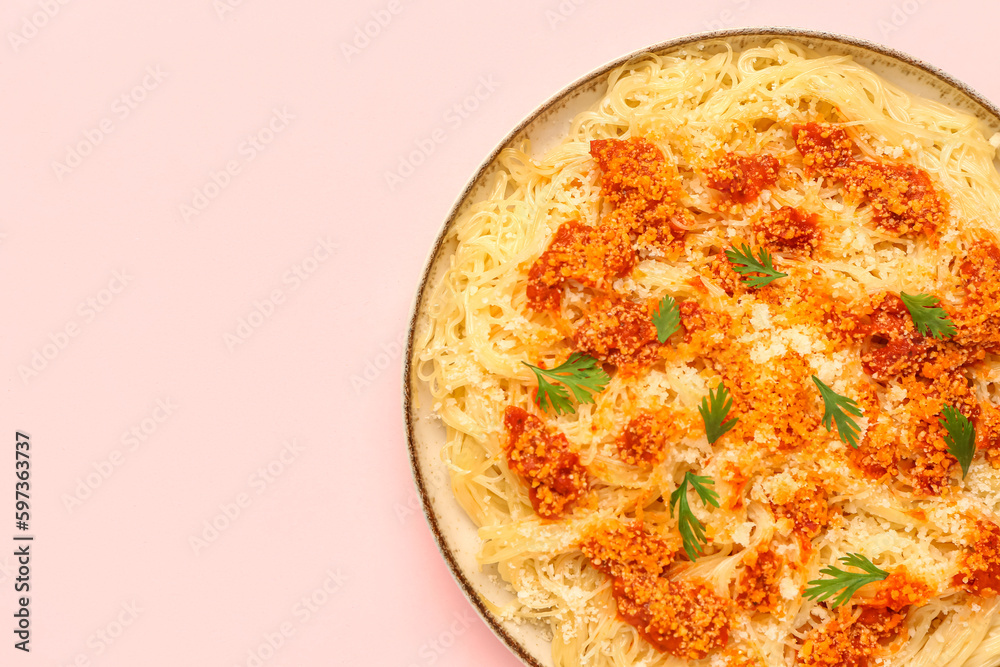 Plate of tasty Italian pasta with Parmesan cheese on pink background, closeup