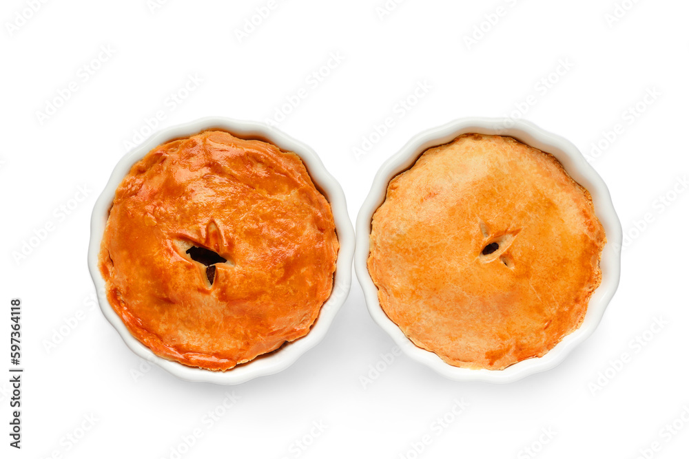 Tasty meat pot pies on white background