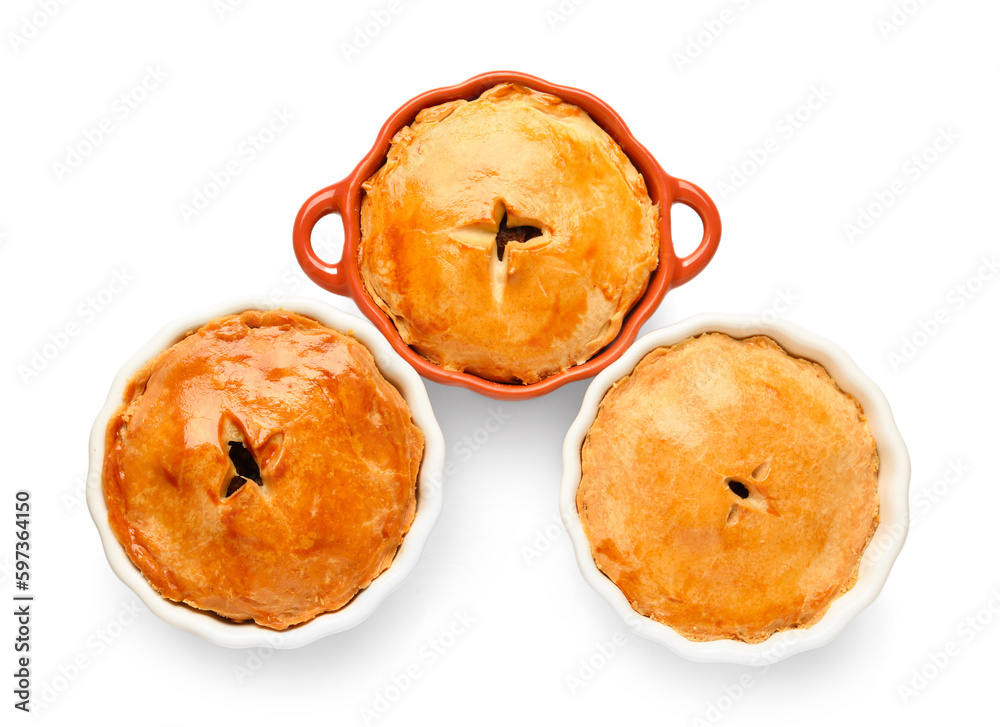 Tasty meat pot pies on white background