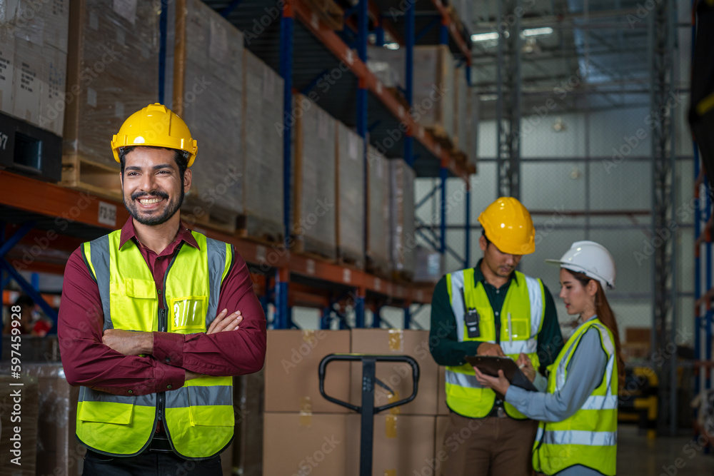 Warehouse worker checking goods and supplies on shelves with goods background in warehouse,Logistic 