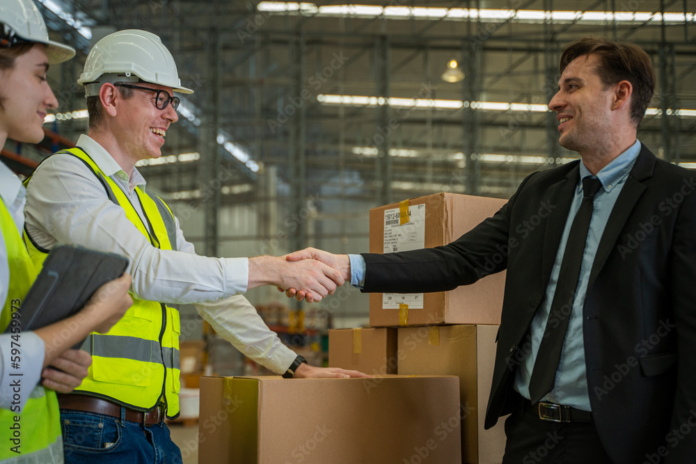 Meeting at warehouse,Warehouse managers with warehouse workers have a briefing in a large distributi