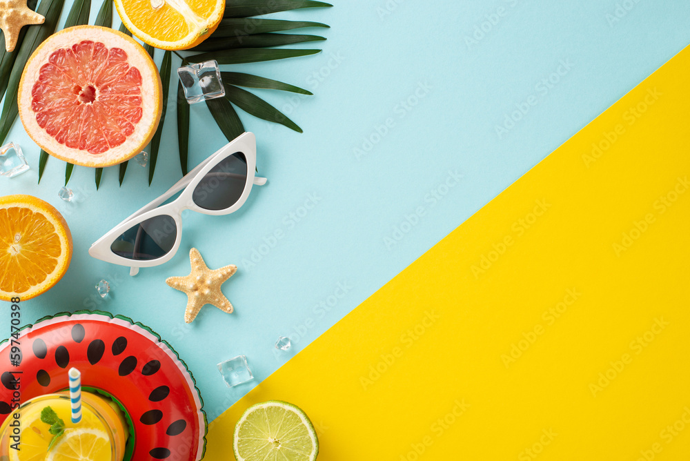 Fun summer vacation concept. Top view flat lay of pool float, cocktail glasses, palm leaves, citrus 