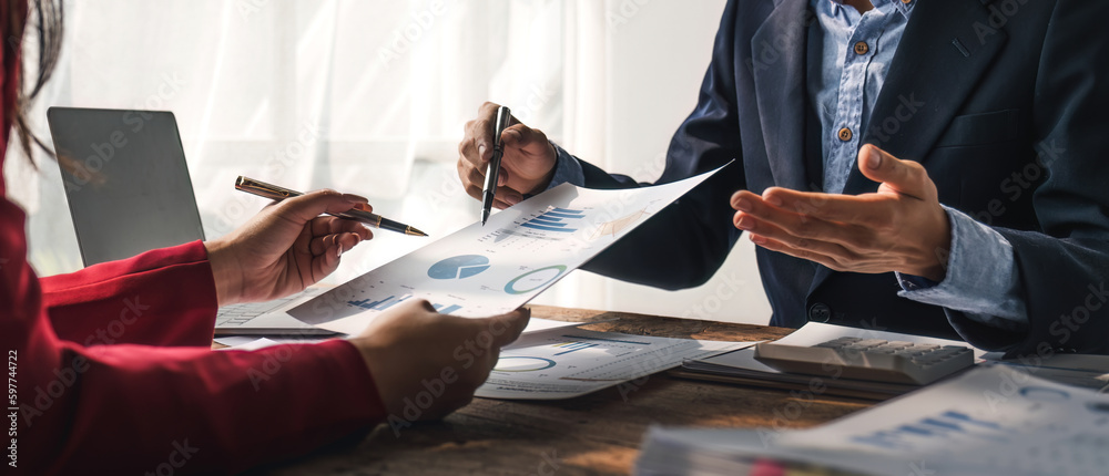 Two business people talk project strategy at office meeting room. Businessman discuss project planni