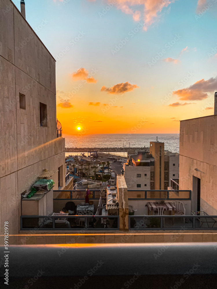 View of beautiful buildings with open balconies at sunset