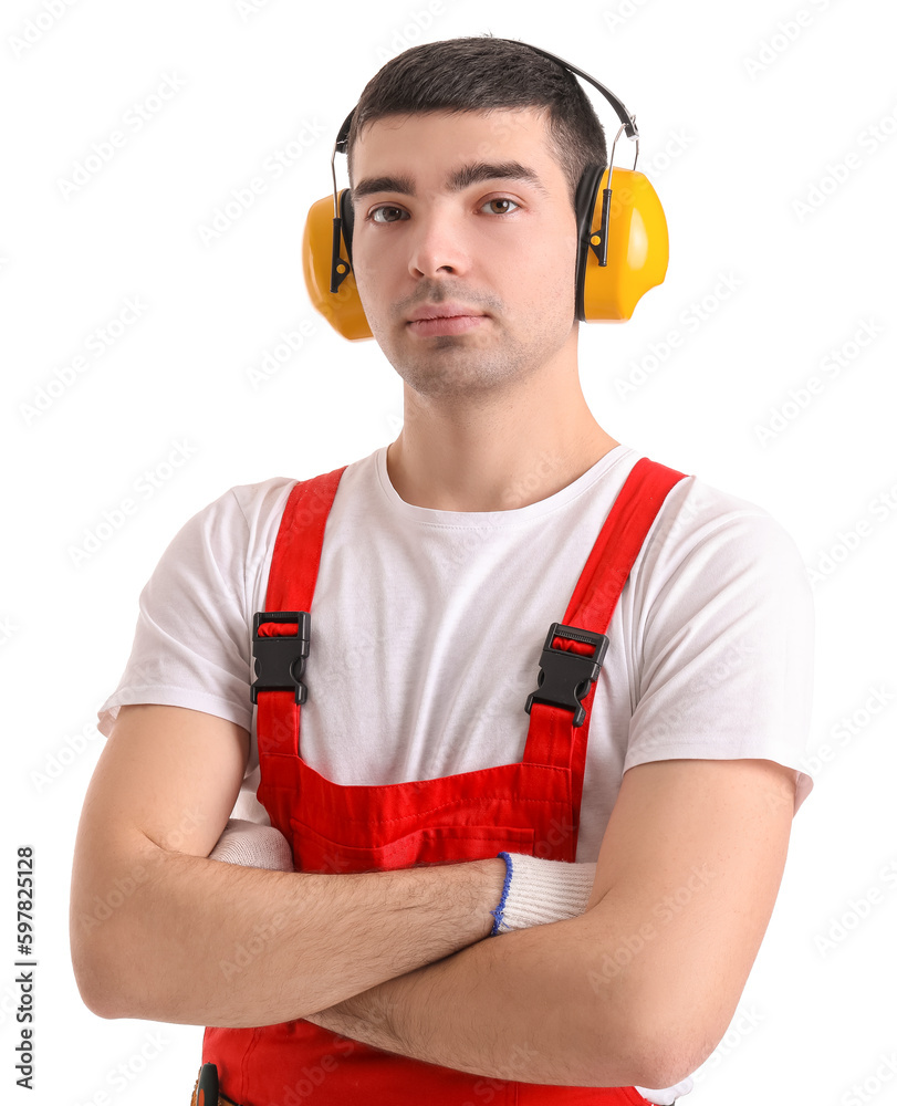 Young carpenter in hearing protectors on white background