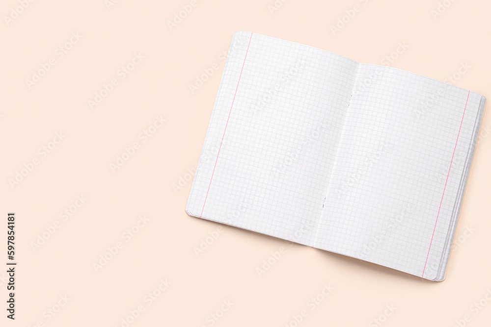 Blank copybook pages on beige background