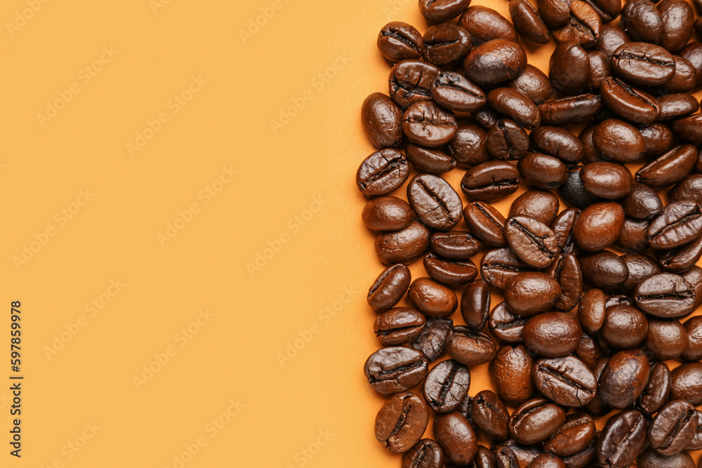 Coffee beans on orange background