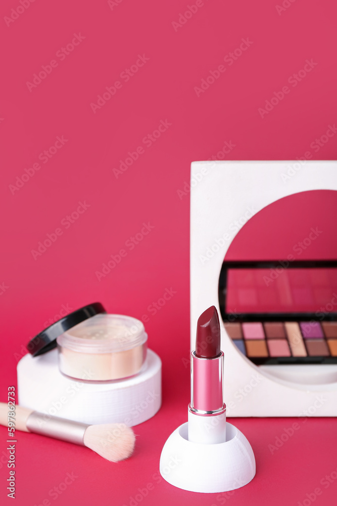 Decorative plaster podiums and cosmetics on red background