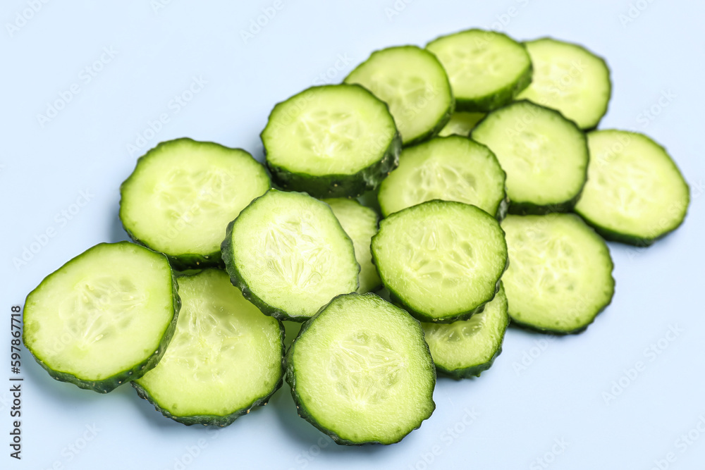 Slices of cucumber on blue background