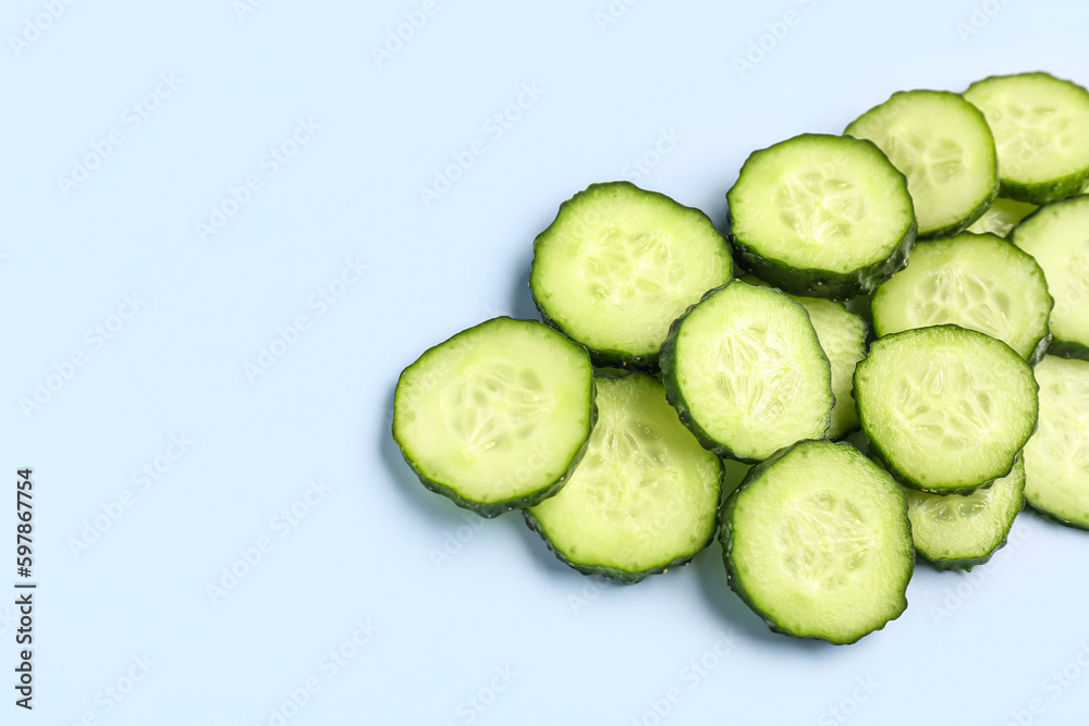 Slices of cucumber on blue background