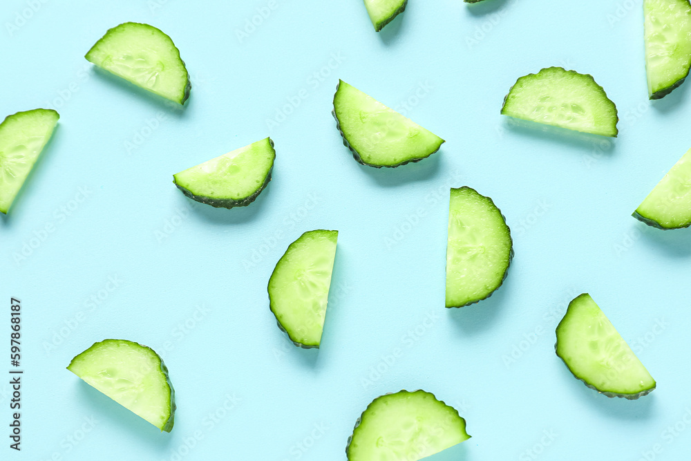 Slices of cucumber on turquoise background