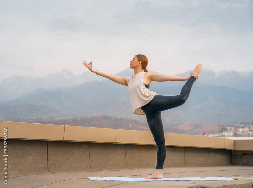 sportswoman is doing yoga