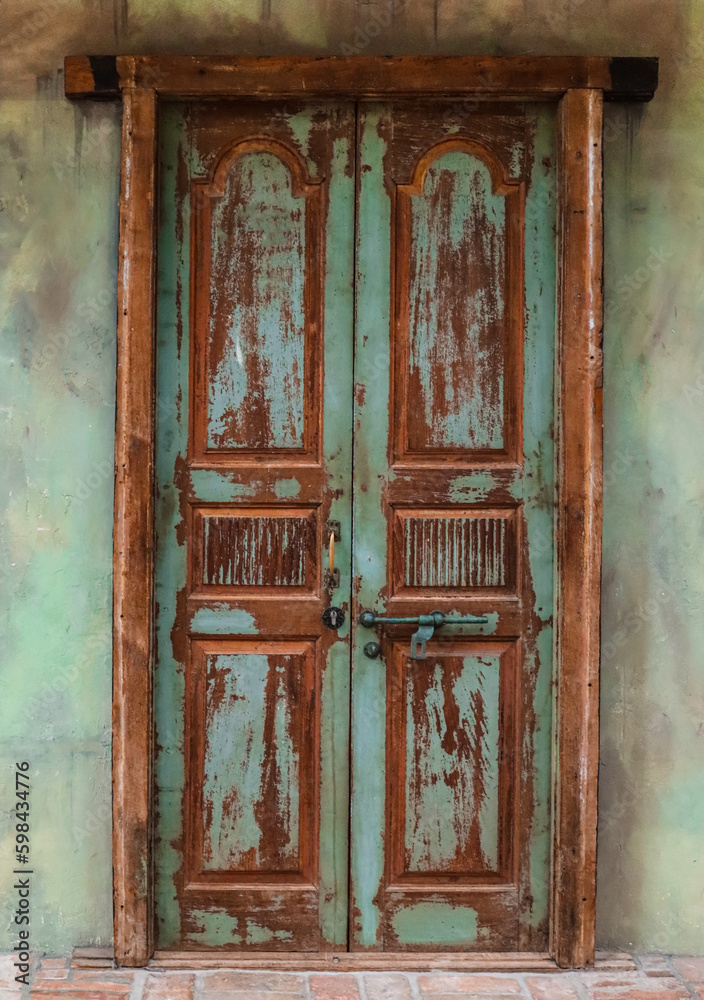 View of old building with wooden door