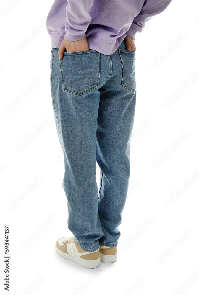 Young woman in stylish jeans on white background