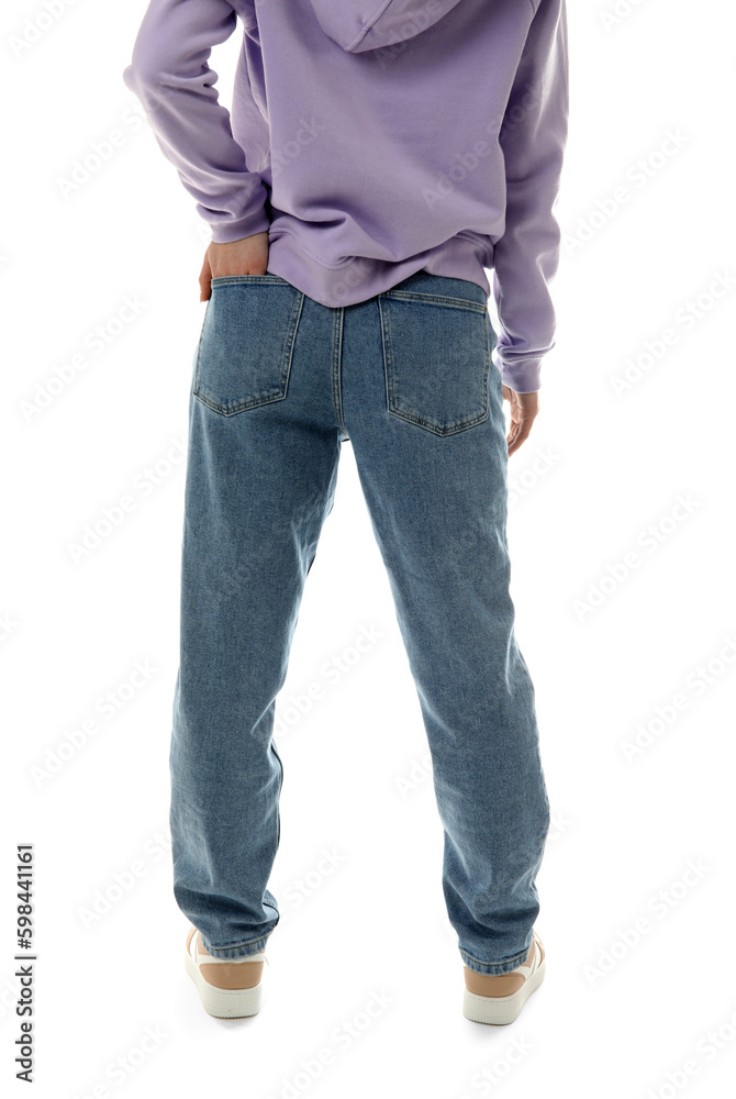 Young woman in stylish jeans on white background