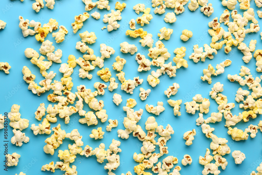 Crispy popcorn on blue background